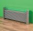 New Yorker stainless steel radiator against green wall