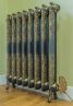 Electric Rococo ornate cast iron radiator in burnished gold with satin gold element